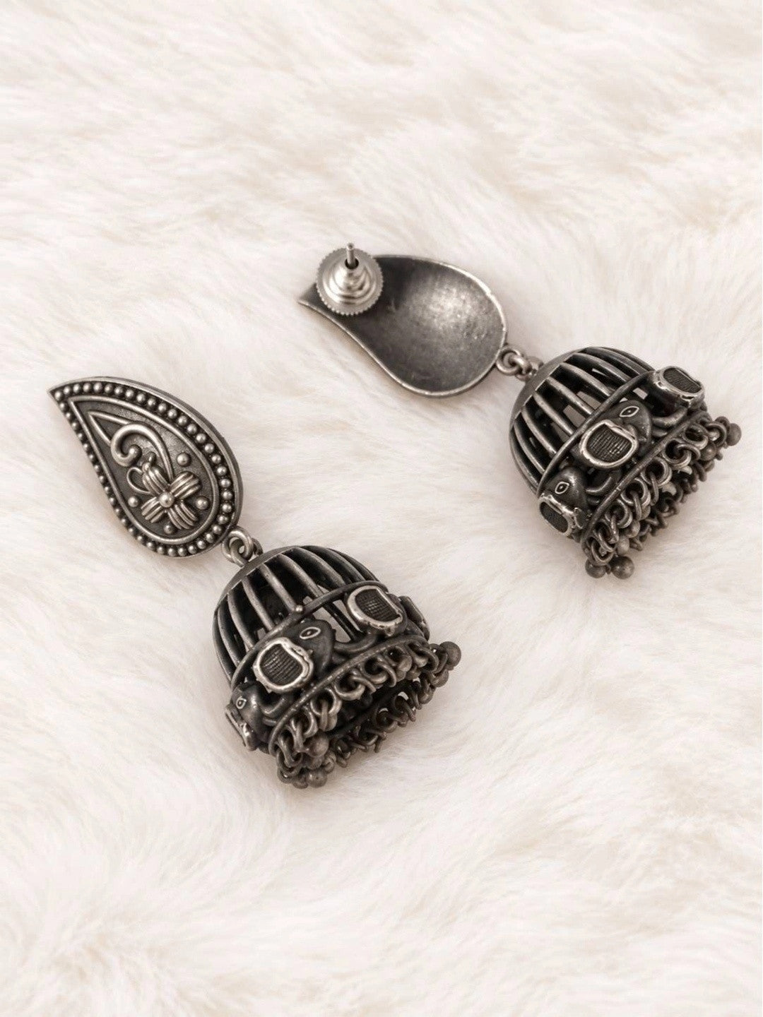 Back view of oxidised silver jhumka earrings showing butterfly push-back closure and dome detail