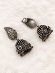 Back view of oxidised silver jhumka earrings showing butterfly push-back closure and dome detail