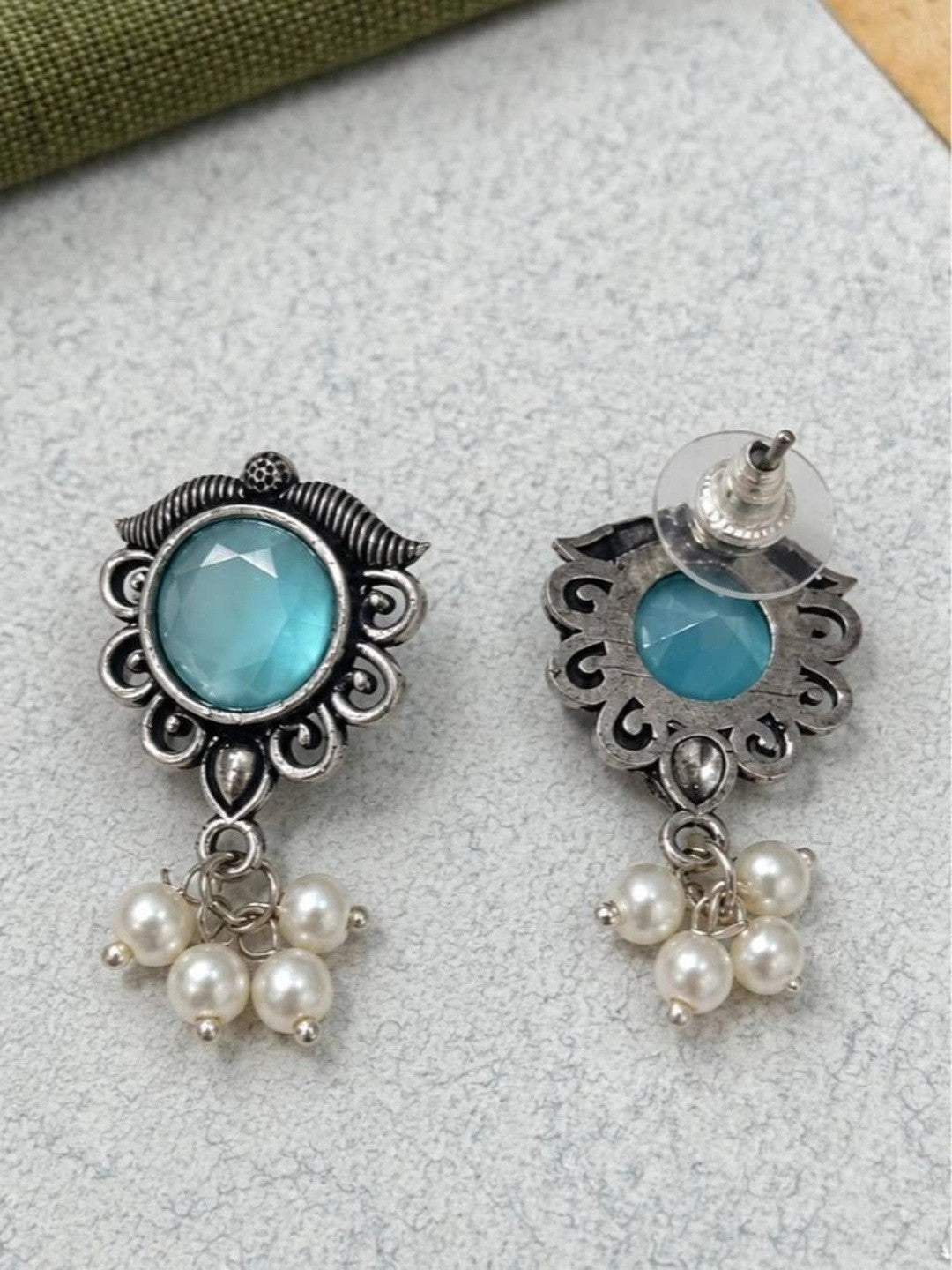 Front and back view of oxidised silver aqua stone stud earrings showing push-back clasp