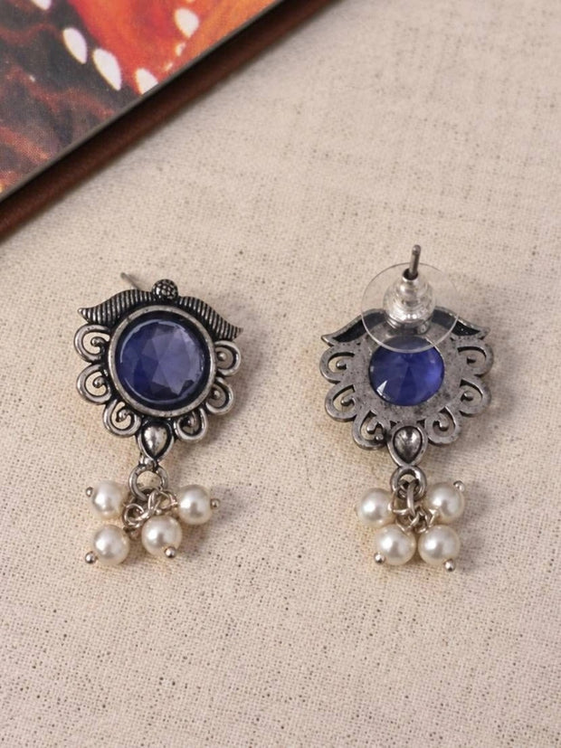 Front and back view of oxidised silver blue stone stud earrings showing push-back butterfly clutch
