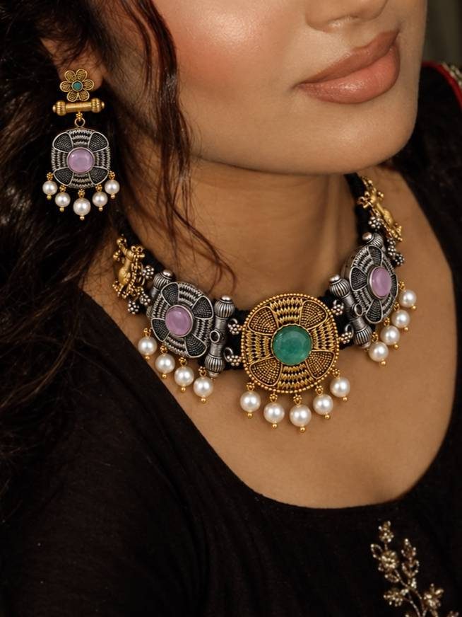 Model wearing oxidised choker necklace and matching earrings with a black ethnic outfit