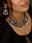 Model wearing oxidised choker necklace and matching earrings with a black ethnic outfit