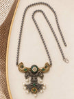 Flat lay of oxidised peacock pendant necklace with ball chain and hook clasp on cream background