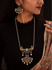Model wearing oxidised peacock necklace and earrings with black top and printed dupatta