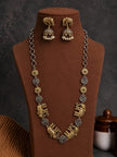 Oxidised gold elephant necklace set with jhumka earrings displayed on a brown velvet bust