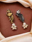 Front and back view of gold-tone peacock earrings with faux pearl cluster drops