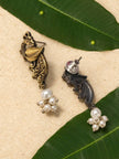 Front and back view of oxidised peacock drop earrings with faux pearl cluster on mango leaves
