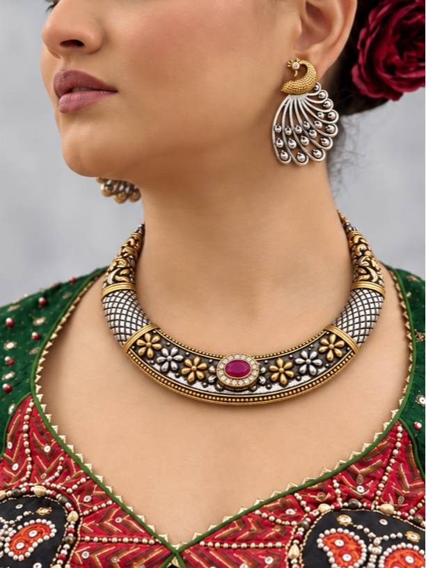 Model wearing oxidised choker necklace and peacock earrings with a red and green embroidered outfit