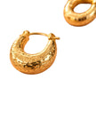 Gold-plated hammered chunky hoop earring on white background with second earring shown from above in corner