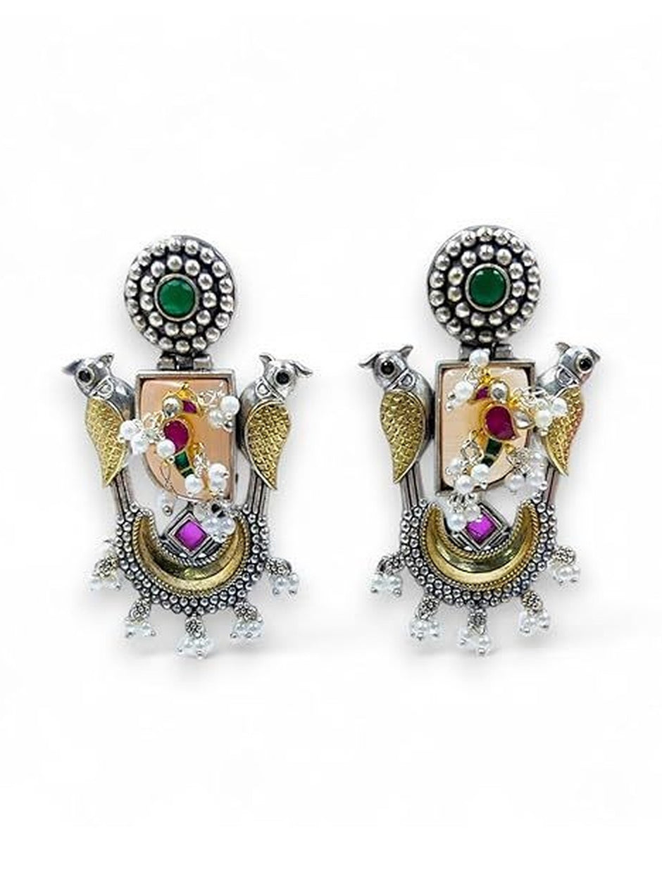 Front view of both oxidised parrot chandbali earrings on white background showing crescent and pearl drops