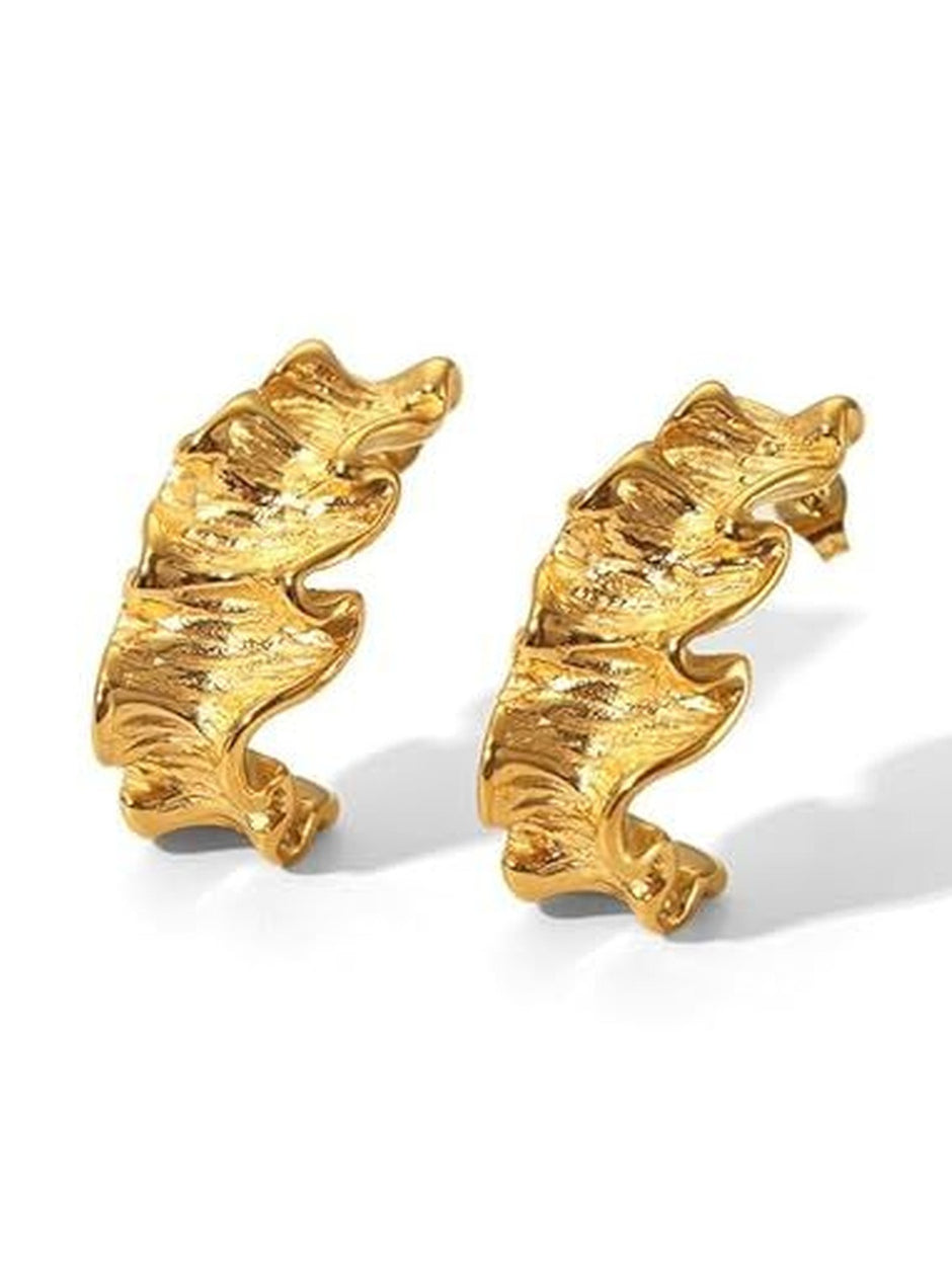 Front view of both gold ruffled hoop earrings on a white background showing wavy sculptural texture