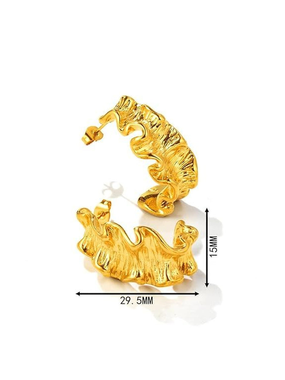 Pair of gold-plated ruffled hoop earrings placed on soft cream satin fabric