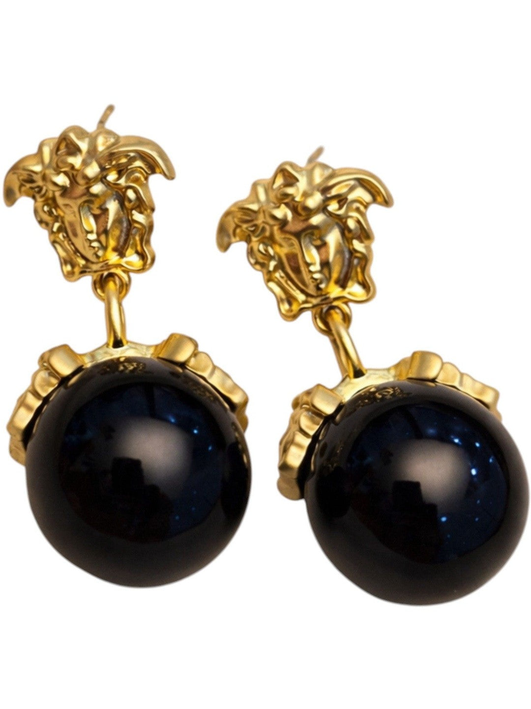 Front view of gold Medusa drop earrings with midnight-blue sphere pendants on white background