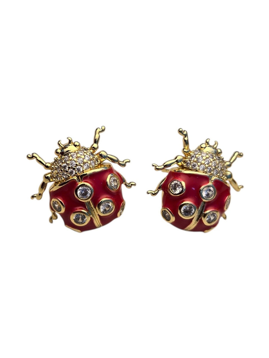 Front-facing product shot of red enamel ladybug studs with pavé thorax and bezel-set CZ stones on white background