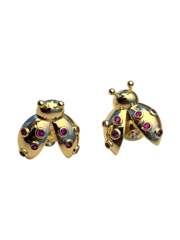 Gold-plated ladybug studs with ruby-red and clear cubic zirconia on a clean white background