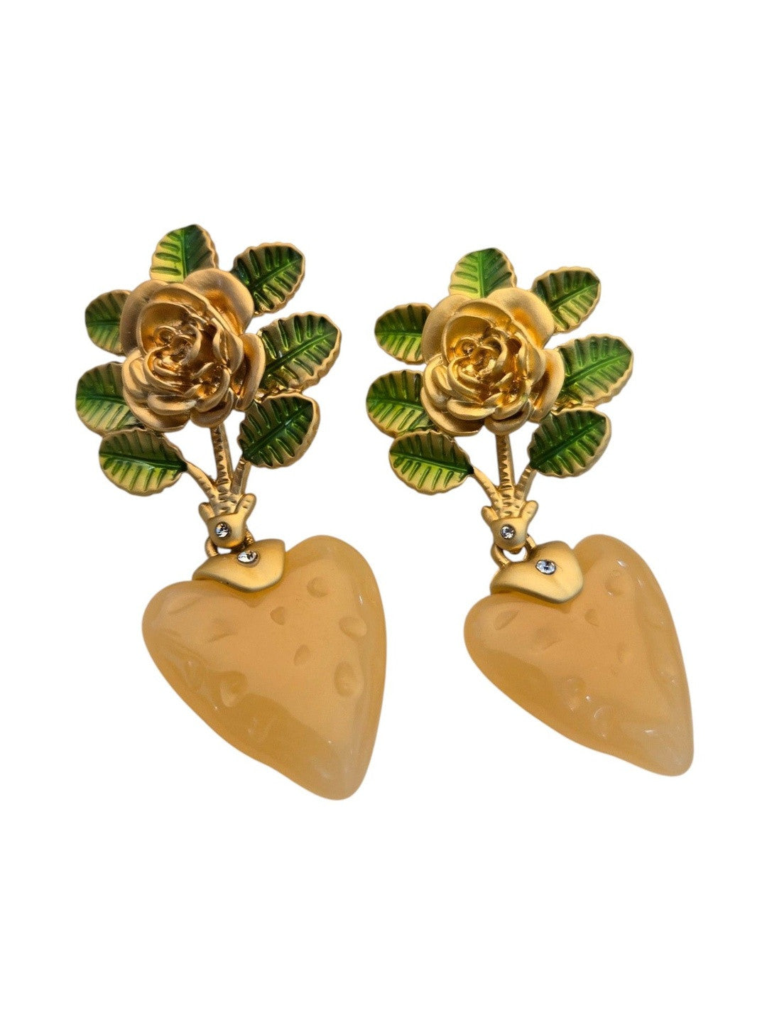 Front-facing gold-plated floral drop earrings with enamelled leaves and frosted peach heart pendants on a white background