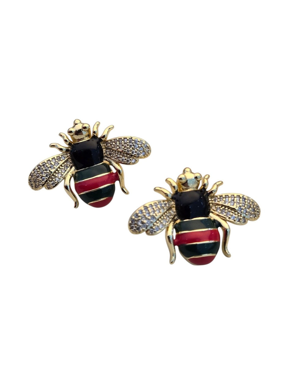 Two gold-plated bee stud earrings showing pavé crystal wings and multicolour enamel stripes on white background