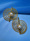 Pair of gold-plated concentric rope stud earrings with pearl centres on blue fabric