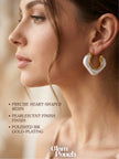 Side profile of woman wearing pearlescent gold-plated resin hoop earring on right ear