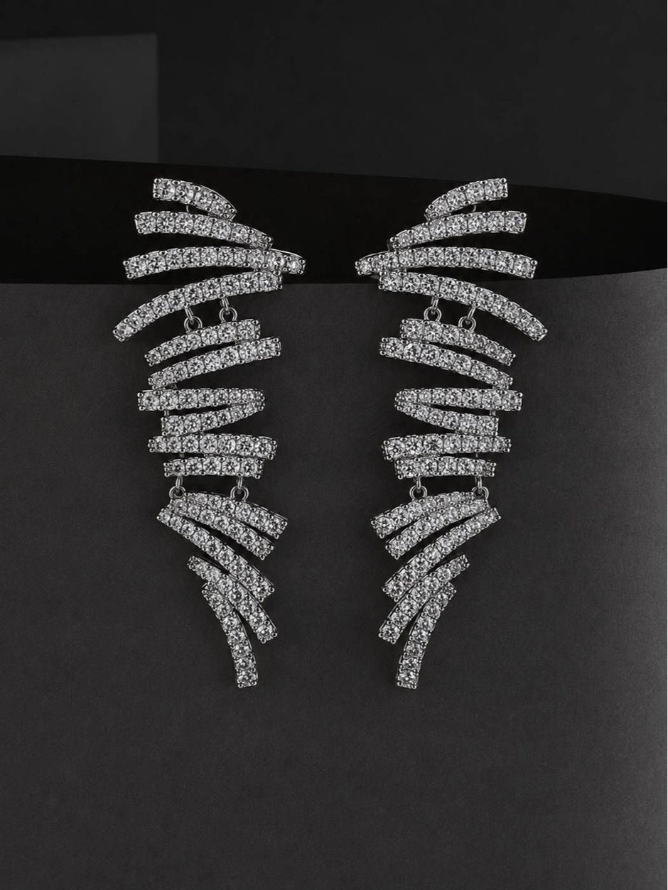 Both silver pave cubic zirconia spiral bar earrings displayed upright against a dark grey background