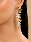 Gold-plated crystal bar drop earring worn on a woman's ear showing full length and scale