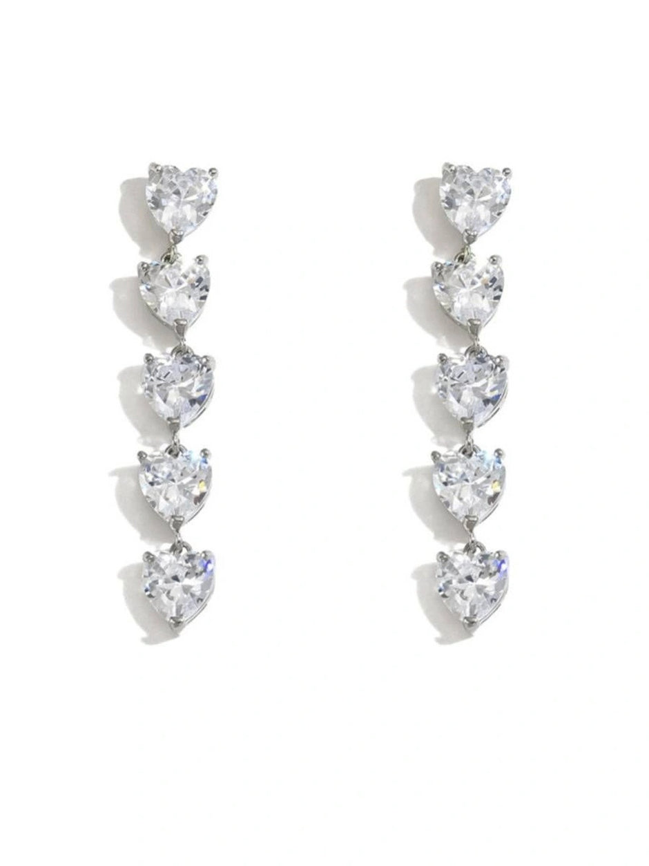Both heart drop earrings photographed flat on a white background showing full length and symmetry