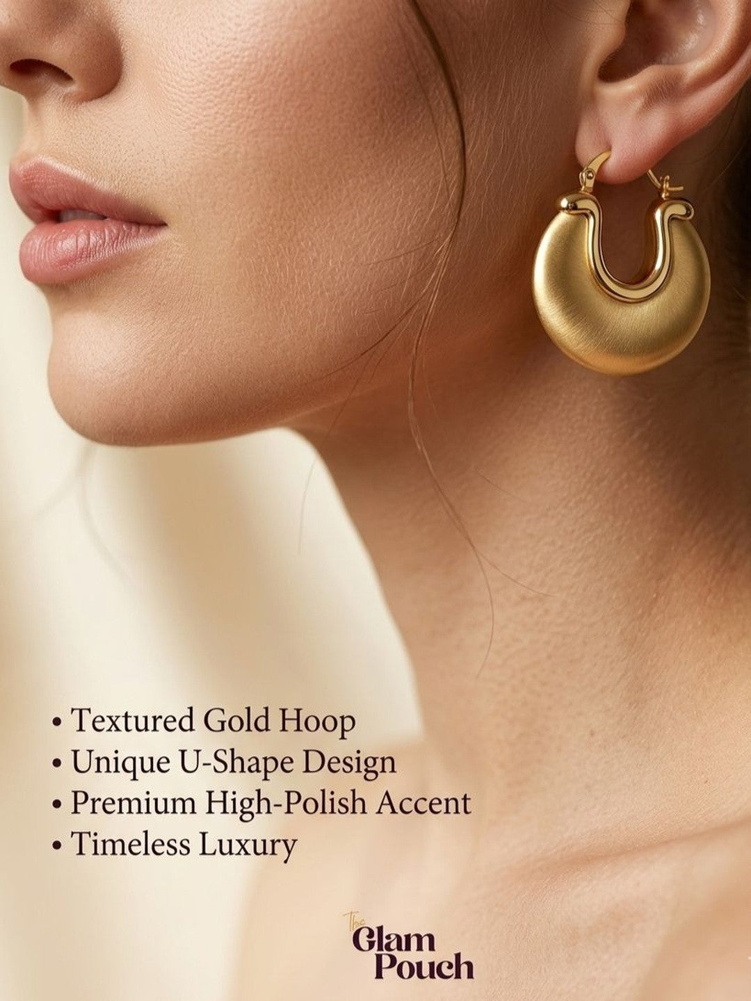 Model wearing one gold matte disc hoop earring in profile view against a soft beige background