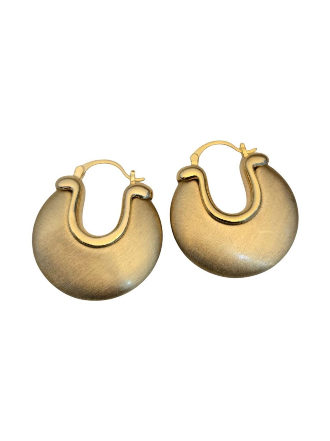 Front-facing pair of gold-tone disc hoop earrings on a white background showing full shape and clasp
