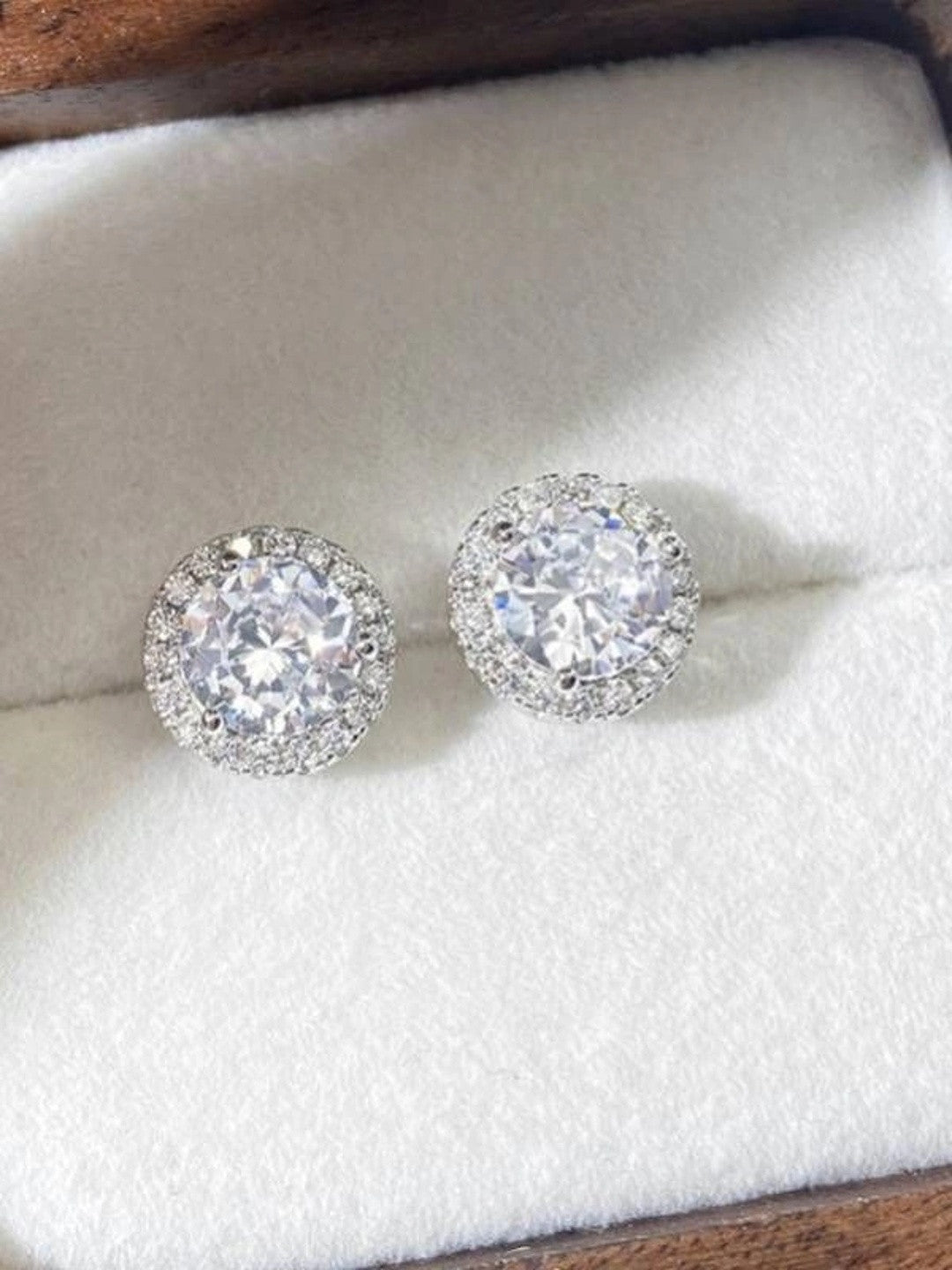 Duplicate of image five showing CZ halo stud earrings in jewellery box from a slightly different angle