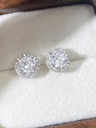 Duplicate of image five showing CZ halo stud earrings in jewellery box from a slightly different angle