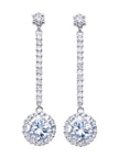 Pair of silver CZ drop earrings on a white background displaying solitaire stud top, pavé bar and round halo pendant