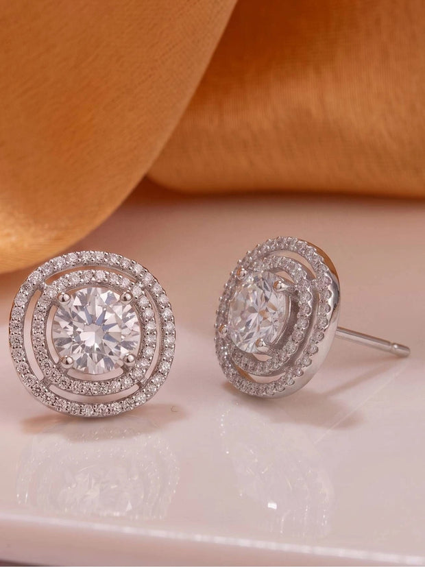 Front and side view of silver circular CZ stud earrings showing butterfly push-back post