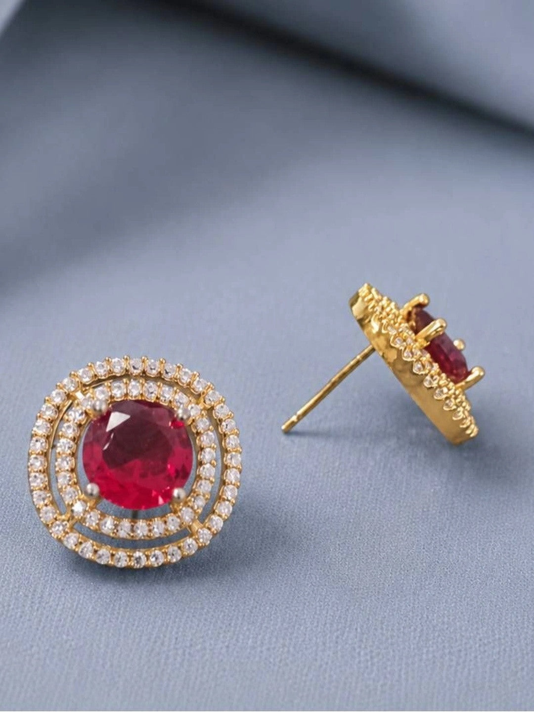 Side and front view of gold-plated ruby CZ double halo studs showing push-back post fitting