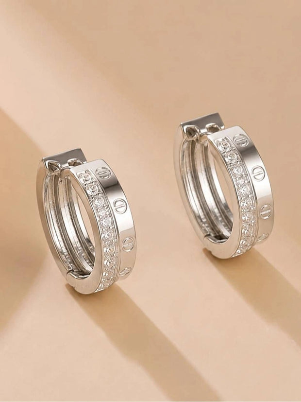 Front view of silver double hoop earrings showing full circular shape and sparkling cubic zirconia row