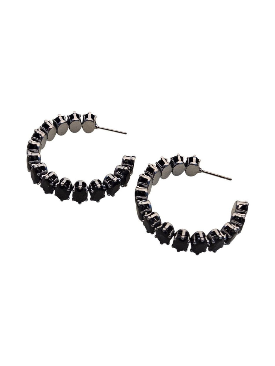 Pair of black oval crystal hoop earrings displayed on a plain white background