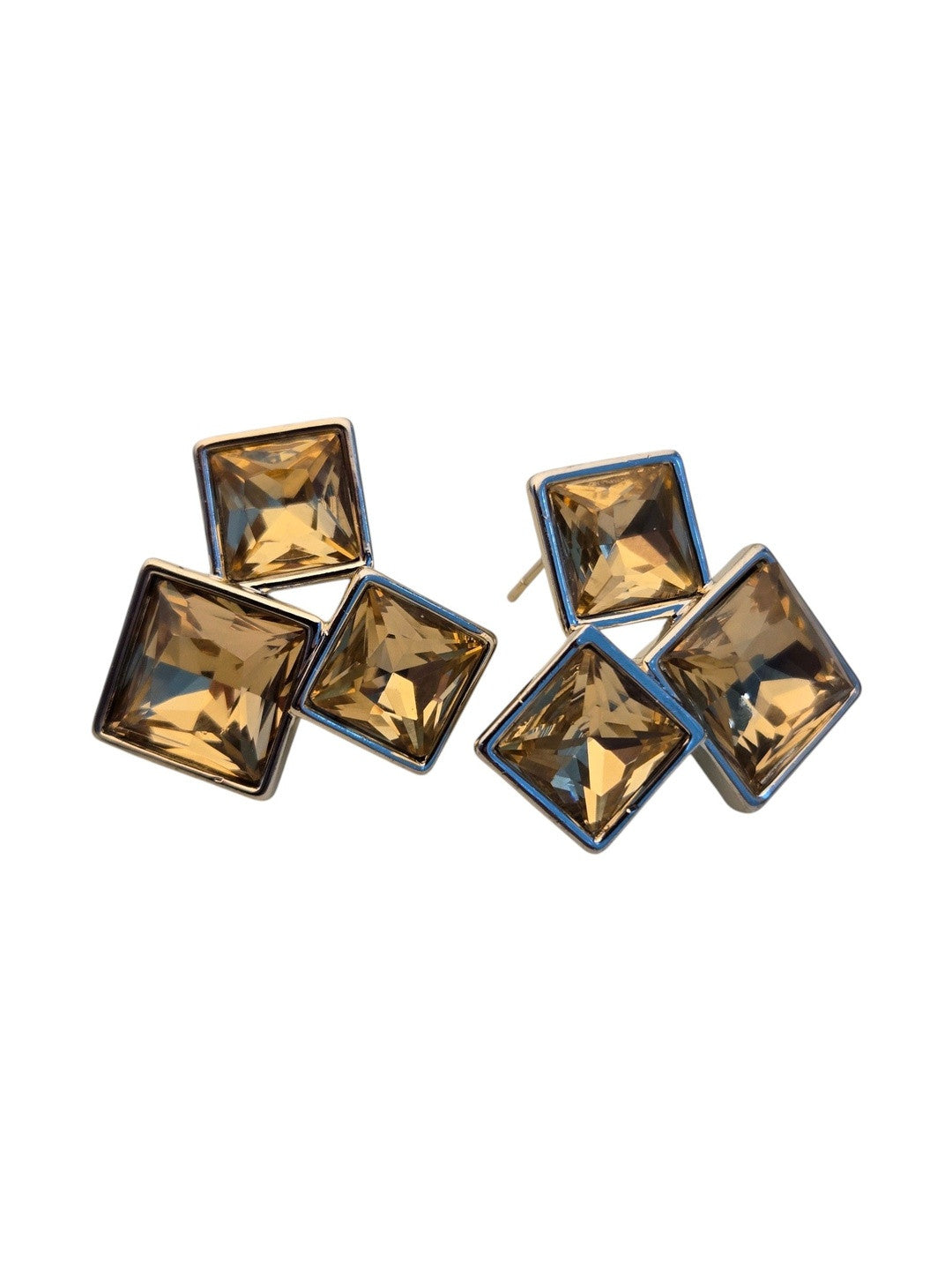 Front view of champagne crystal square cluster studs on a clean white background showing facet detail