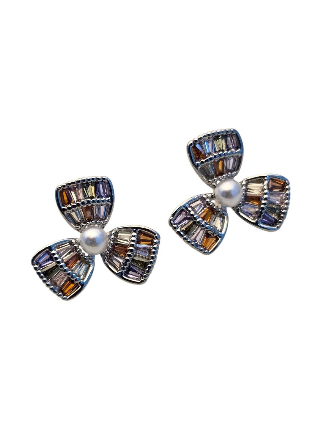Front view of multicolour CZ baguette flower stud earrings with faux pearl centre on white background