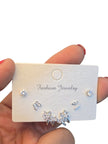 Close-up of Fashion Jewelry card showing round solitaire studs, butterfly pavé studs and floral ear cuff on white background