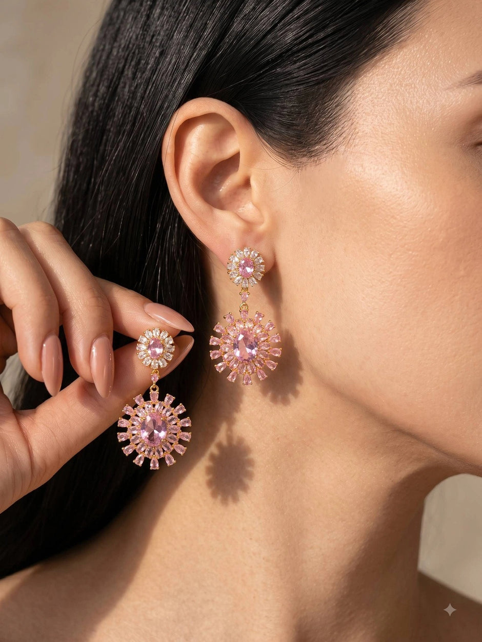 Woman wearing gold-plated pink CZ floral drop earrings, side profile close-up