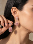 Woman wearing gold-plated pink CZ floral drop earrings, side profile close-up