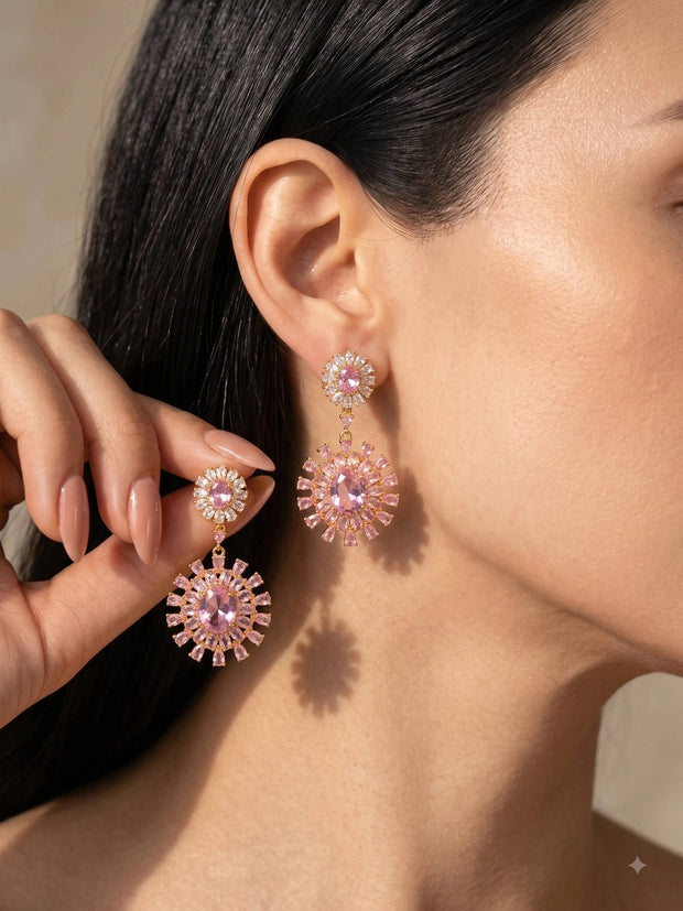 Woman wearing gold-plated pink CZ floral drop earrings, side profile close-up