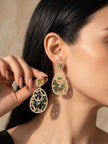 Woman wearing gold-plated multicolour CZ teardrop drop earrings with green yellow and pink stones