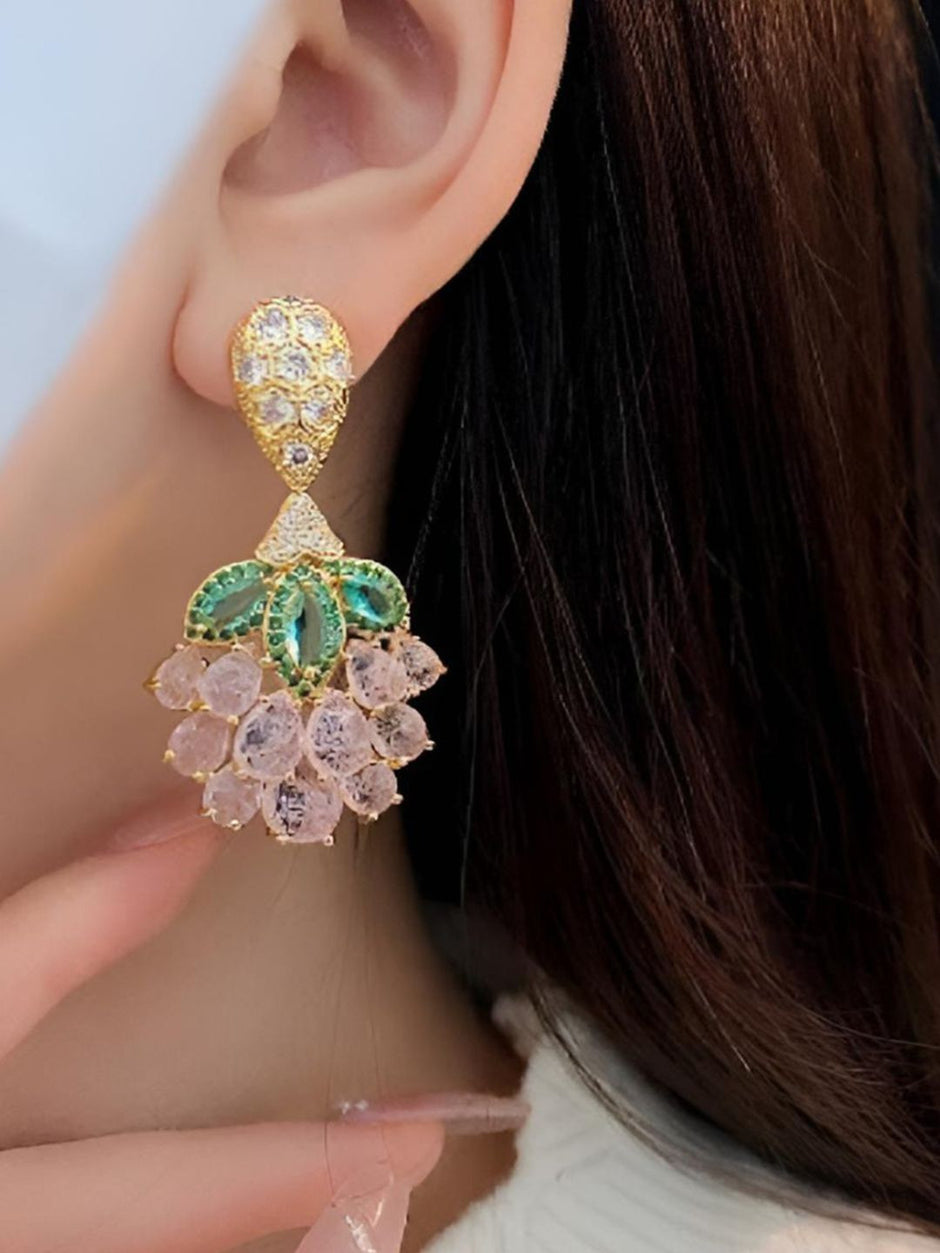 Gold-plated pink crystal drop earring worn on a womans ear showing full length and scale