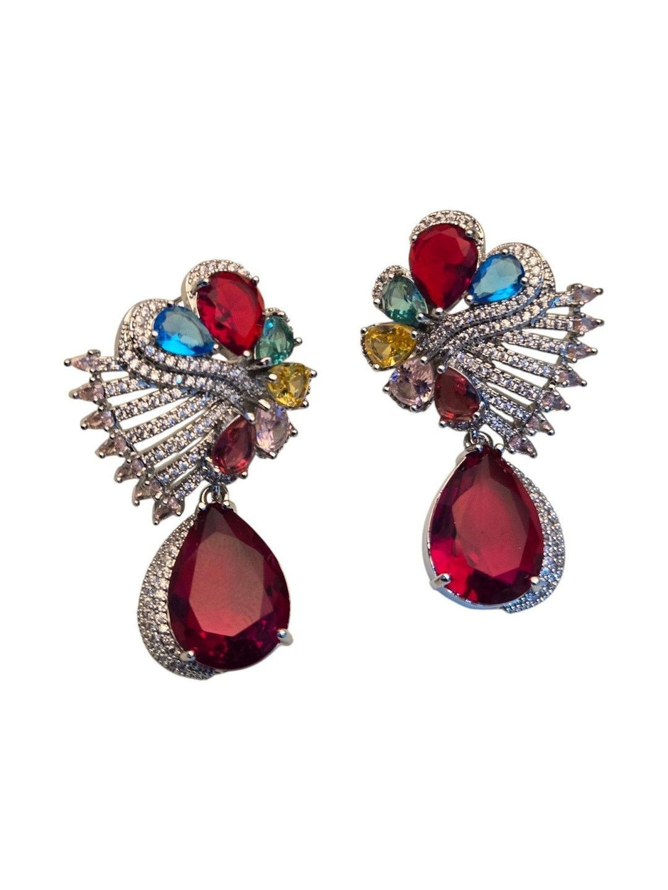Front view of silver rhodium-finish earrings with blue teal yellow pink and red crystals on white background