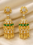 Pair of gold-plated chandelier earrings with white and yellow CZ stones and emerald-green centre row laid on cream silk fabric
