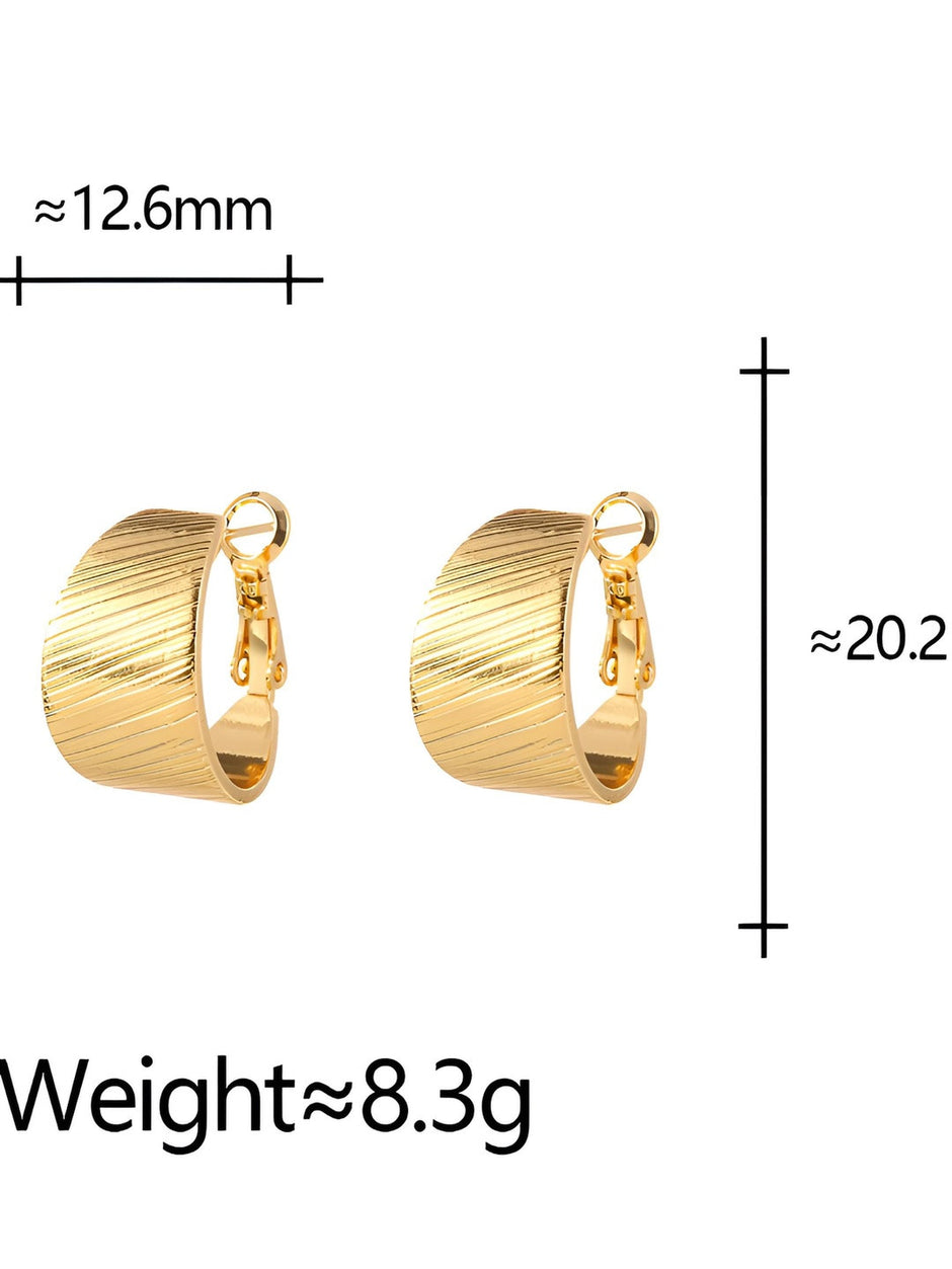 Side view of two gold-plated wide band hoop earrings showing curved profile and latch closure