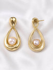 Front and back view of gold pearl drop earrings showing push-back stud post on white satin