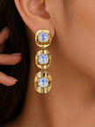 Model wearing gold-plated crystal drop earrings showing full length and scale on ear