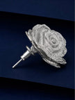 Side view of a single silver rose stud earring showing push-back post and layered petal depth