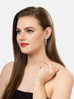 Duplicate of image five — same on-ear shot of the silver CZ bow drop earring